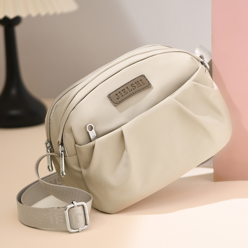 O1CN01d7IykA1JJi9fNrKoE_2216779931008-0-cib.jpg Pleated Oxford Cloth Shoulder Messenger Phone Bag - Image 1